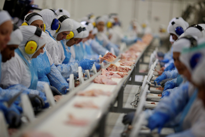 Employees are seen during a technical visit of Brazil's Agriculture Minister Blairo Maggi at the Brazilian meatpacker JBS SA in Lapa