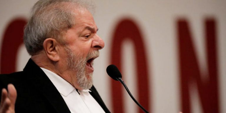 Former Brazil's President Luiz Inacio Lula da Silva gestures during a seminar on public education in Brasilia