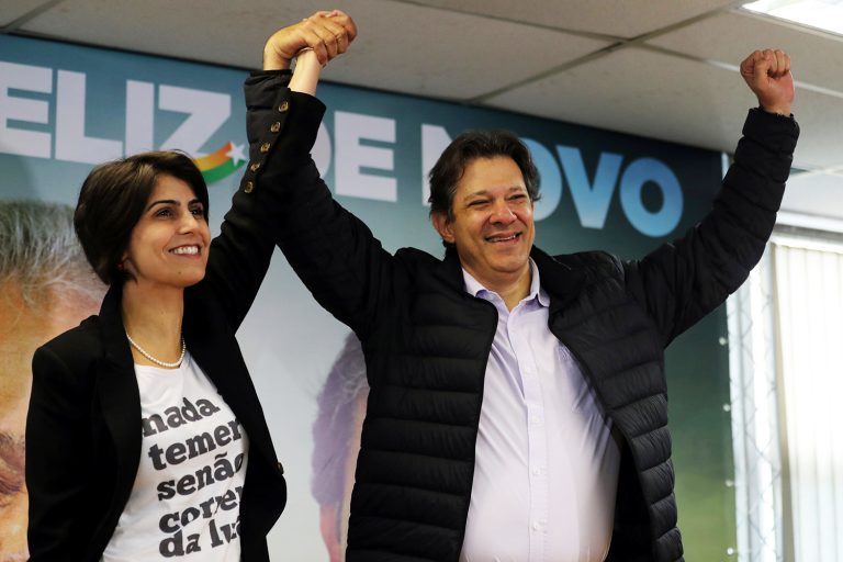 Fernando Haddad, former Sao Paulo mayor and member of Workers' Party (PT), and Manuela D'avila of the Communist Party of Brazil (PCdoB) pose before a media conference in Sao Paulo