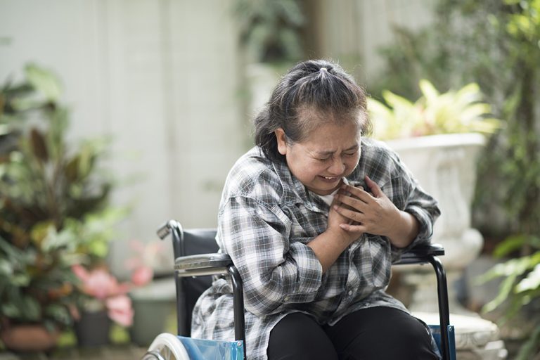 elderly woman have heart disease sitting on wheelchair